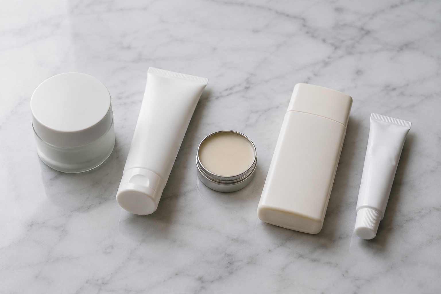 Five essential skincare products for an Accutane routine arranged in order on a bathroom counter in natural light.
