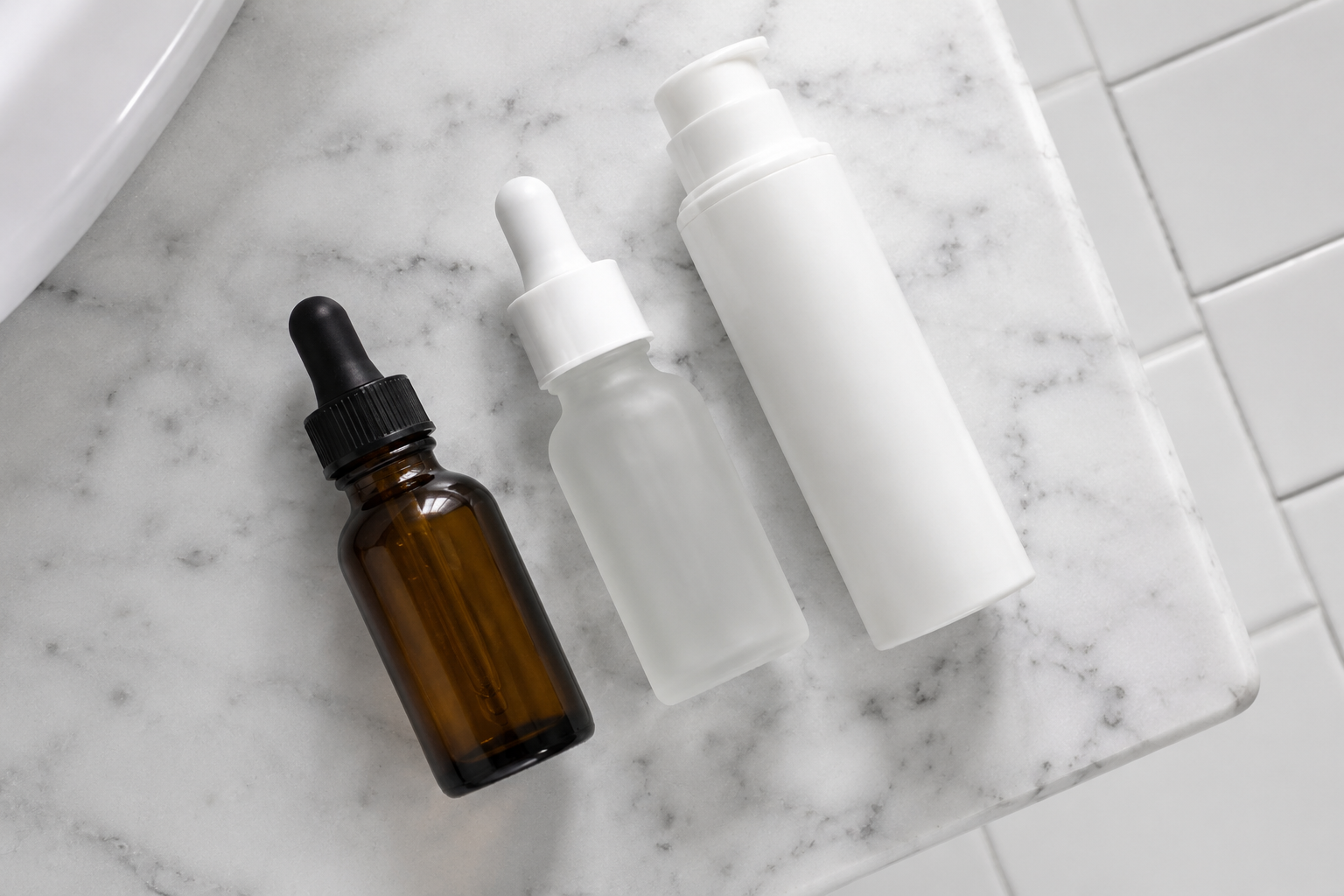 Gentle moisturizer, mineral sunscreen, and hydrating toner arranged as an Accutane-safe skincare routine.