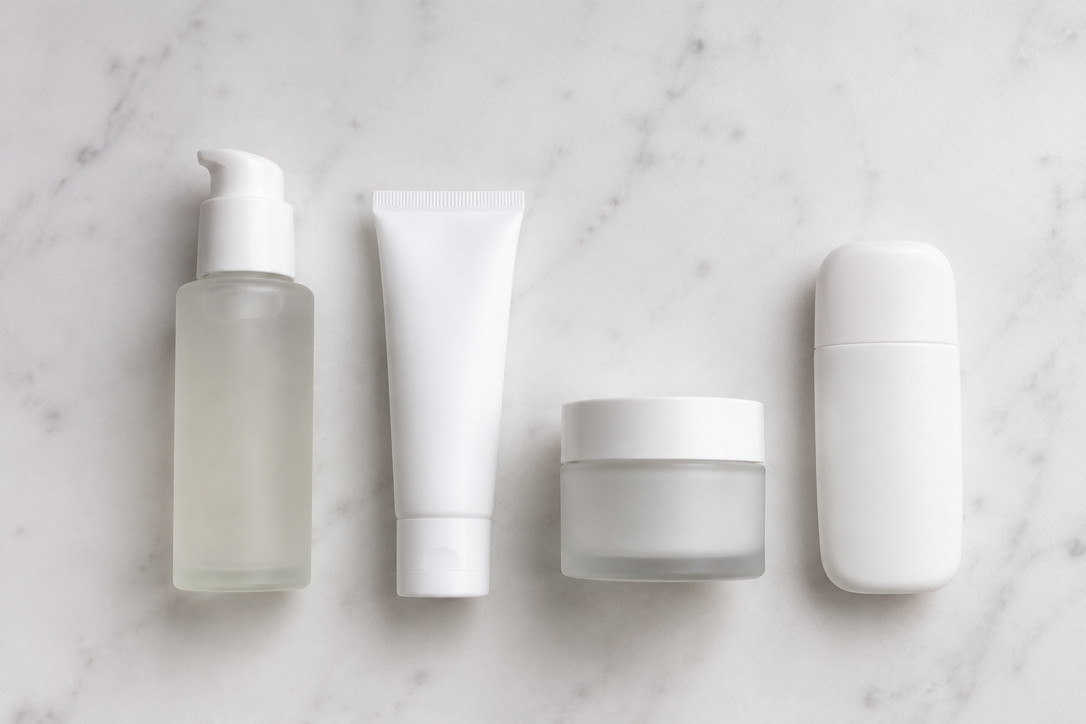 Ordered acne skincare routine products on bathroom counter: cleanser, prescription treatment, moisturizer, SPF sunscreen